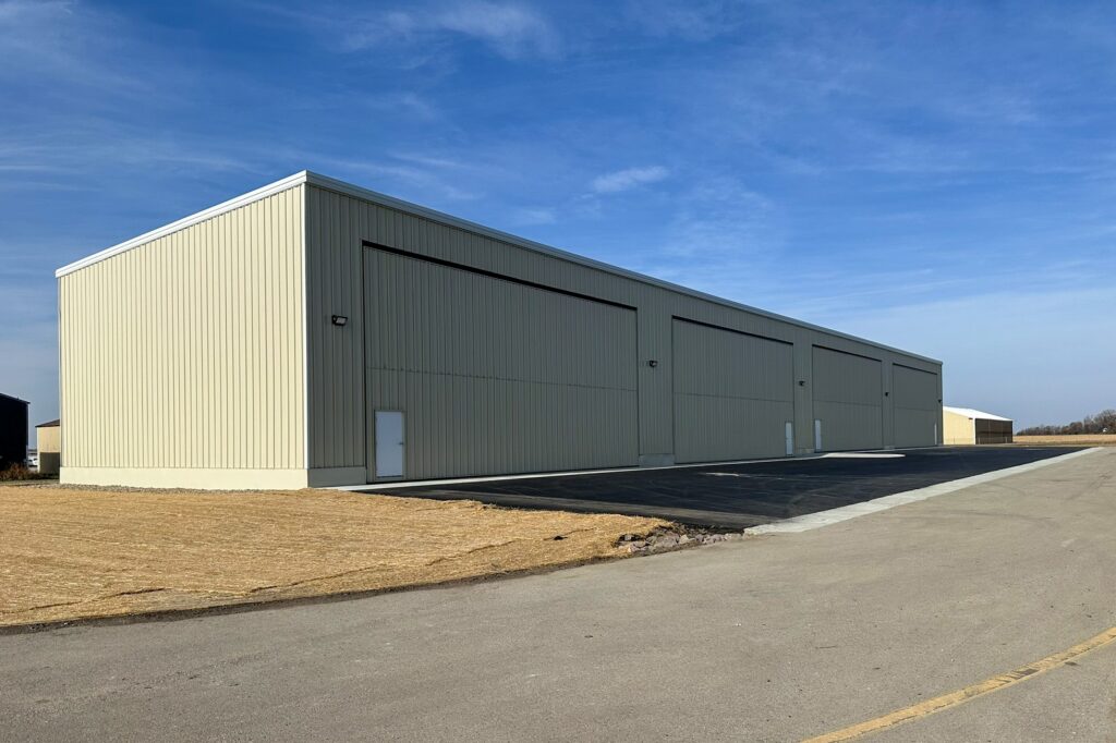Premanufactured four-unit aircraft storage hangars at Waseca Municipal Airport designed by TKDA to support flexible aircraft storage and long-term airport revenue growth